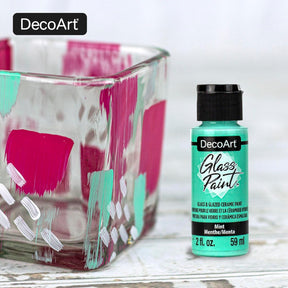 DecoArt glass paint set with 9 opaque colors in 2 fl oz bottles, ideal for glass and ceramic craft projects.
