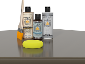 Retique It® Black Walnut Brush-On Kit with Gloss PolyTique® includes a brush, Light Wood primer, Black Walnut Gel Stain Alternative, Gloss PolyTique® top coat, and a yellow sponge.