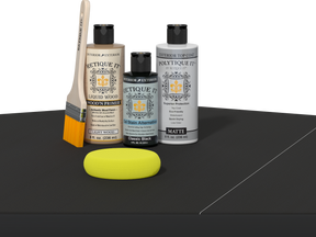 Retique It® Classic Black Brush-On Kit with Matte PolyTique® includes a brush, Light Wood primer, Classic Black Gel Stain Alternative, Matte PolyTique® top coat, and a yellow sponge.