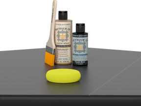 Retique It® Classic Black Brush-On Kit includes a brush, Light Wood primer, Classic Black Gel Stain Alternative, and a yellow sponge.
