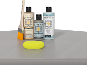 Retique It® Weathered Wood kit with brush, Wood’n Primer, stain alternative, matte top coat, and yellow sponge.