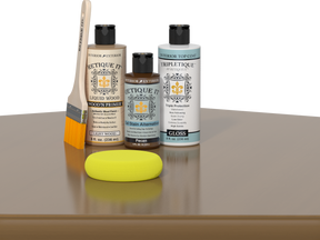 Retique It® Light Wood kit with brush, Pecan stain alternative, gloss top coat, and yellow sponge.