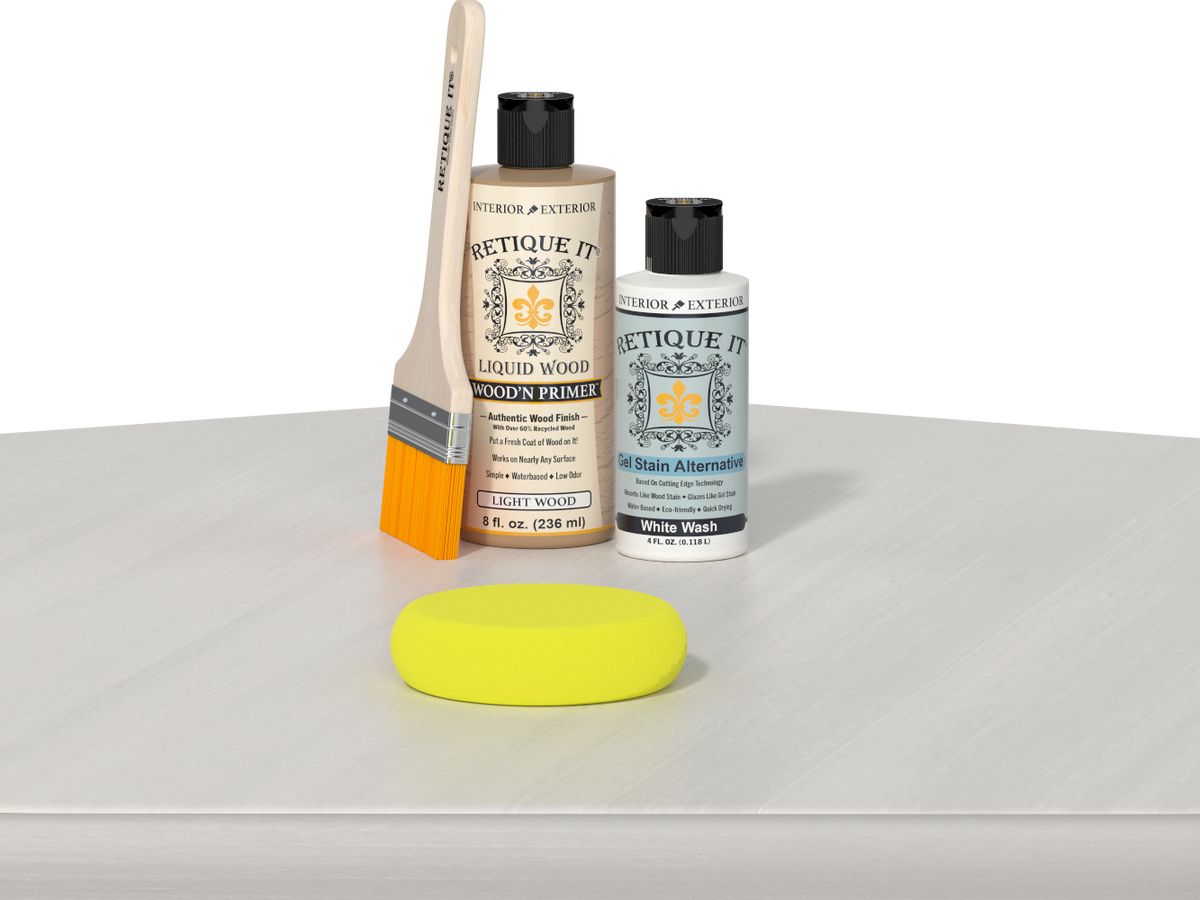 Retique It® Light Wood Wood’n Primer with White Wash Gel Stain Alternative, brush, and yellow sponge on a white tabletop.