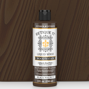 Retique It® Liquid Wood Wood'n Stain in 8 oz Black Walnut, showcasing the dark brown stain color on a wood surface.