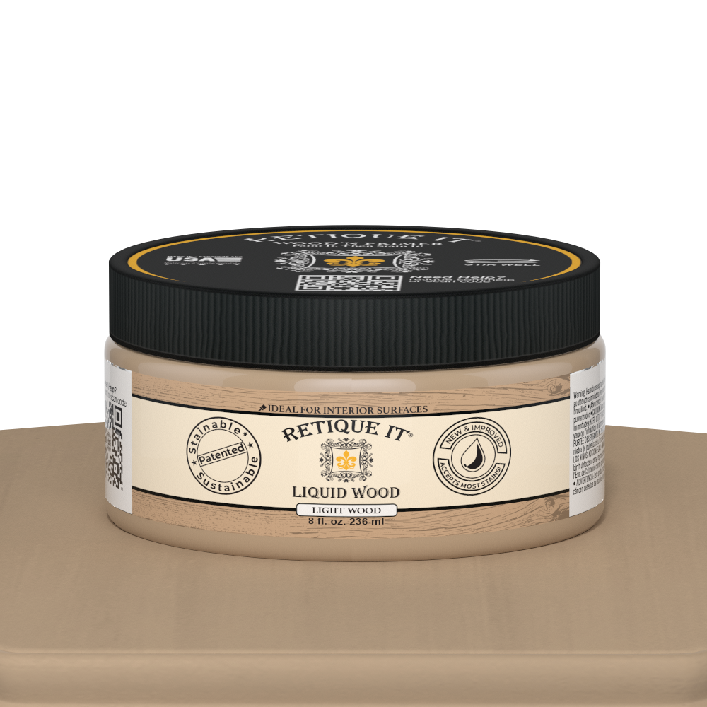 Retique It® Liquid Wood 8oz light interior paint jar on table, showcasing natural wood finish and smooth paint texture.