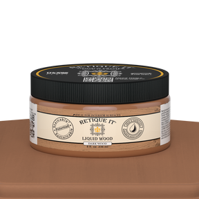 Dark liquid wood paint by Retique It® in an 8oz jar displayed on a table, ready for interior wood finishing projects.