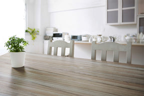 Raw wood tabletop with a natural, grained finish from Retique It® Bleached Wood Wood'n Finish Kit, showing a smooth, light-colored surface.
