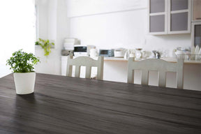 Large Harbor Gray Wood'n Kit interior top coat applied to a grained wooden tabletop, showcasing the wood finish and texture.