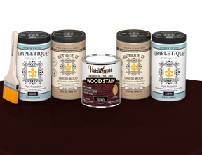 64 oz Retique It Liquid Wood kit with Black Cherry stain, gloss Tripletique topcoat, and a paintbrush on a matching finished tabletop.