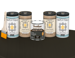 64 oz Retique It Liquid Wood kit with Carbon Gray stain, matte Tripletique topcoat, and a paintbrush on a matching finished tabletop.