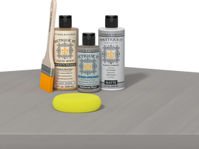 Retique It® Wood'n Finish Kit in Weathered Wood with smooth top coat, shown on a wooden table for exterior wood finishing.