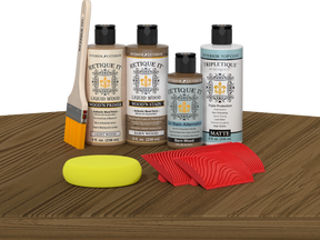 Retique It® Barn Wood Wood'n Kit with Light Wood primer, Barn Wood stain, Barn Wood gel stain alternative, Matte Tripletique® Top Coat, brush, red graining tool, and yellow sponge.