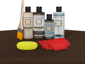 Retique It® Black Walnut Wood'n Kit with Matte TripleTique® includes a brush, Light Wood primer, Black Walnut stain, Black Walnut Gel Stain Alternative, Matte TripleTique® top coat, a yellow sponge, and a red graining tool.
