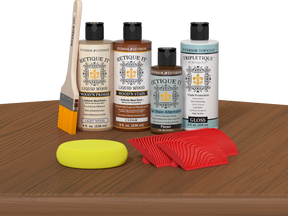 Retique It® Cedar Wood'n Kit with Light Wood primer, Cedar stain, Pecan gel stain alternative, Gloss Tripletique® Top Coat, brush, red graining tool, and yellow sponge.
