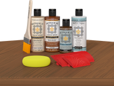 Retique It® Cedar Wood'n Kit with Light Wood primer, Cedar stain, Pecan gel stain alternative, Matte Tripletique® Top Coat, brush, red graining tool, and yellow sponge.