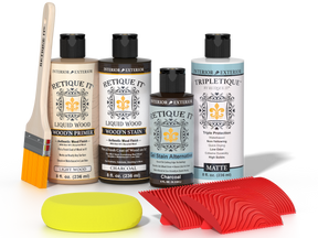 Retique It® Wood'n Finish Kit in Charcoal for tabletops, featuring stain bottles and application tools on a wooden surface.