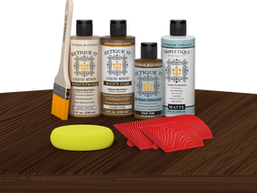 Retique It® Dark Oak Wood'n Kit with Light Wood Primer, Dark Oak Wood'n Stain, Matte TripleTique Top Coat, yellow sponge, red graining tool, and brush.