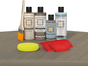 Retique It® Drift Wood Wood'n Kit with Light Wood primer, Drift Wood stain, Weathered Wood gel stain alternative, Matte Tripletique® Top Coat, brush, red graining tool, and yellow sponge.