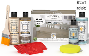 Retique It® Drift Wood Wood Tabletop Kit with Light Wood primer, Drift Wood stain, Weathered Wood gel stain alternative, Matte Tripletique® Top Coat, brush, red graining tool, yellow sponge, and product box.