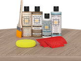Retique It® Wood'n Finish Kit in French Oak stain displayed on a table, showing the wood finish application and color detail.