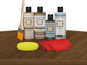 Retique It® Medium Walnut Wood'n Kit with Light Wood primer, Barn Wood stain, Pecan gel stain alternative, Matte Tripletique® Top Coat, brush, red graining tool, and yellow sponge.