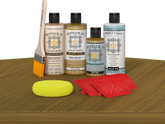Retique It® Old Oak Wood'n Kit with Light Wood primer, Old Oak stain, Old Oak gel stain alternative, Matte Tripletique® Top Coat, brush, red graining tool, and yellow sponge.
