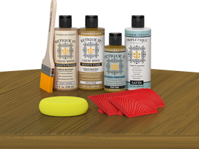 Retique It® Old Oak Wood'n Kit with Light Wood primer, Old Oak stain, Old Oak gel stain alternative, Satin Tripletique® Top Coat, brush, red graining tool, and yellow sponge.