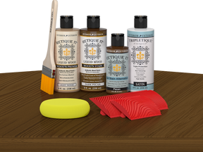 Retique It® Wood'n Finish Kit in Dark Pecan stain, featuring wood stain bottles and applicator on a table for wood finishing.