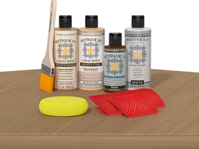 Retique It® Wood'n Finish Kit in Pickled Oak, exterior top coat with wood finish and application tools on table.
