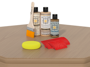 Wood care products including bottles, a brush, and a sponge on a wooden surface.
