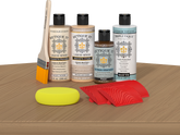 Retique It® Pickled Oak Wood'n Kit with Light Wood Primer, Pickled Oak Wood'n Stain, Matte TripleTique Top Coat, Pecan Gel Stain Alternative, yellow sponge, red graining tool, and brush.