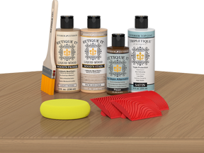 Retique It® Pickled Oak Wood'n Kit with Light Wood Primer, Pickled Oak Wood'n Stain, Satin TripleTique Top Coat, Pecan Gel Stain Alternative, yellow sponge, red graining tool, and brush.