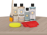 Retique It® Wood'n Finish Kit Sun Bleached tabletop with wood finish in a natural, sun-bleached tone, showing application on surface.