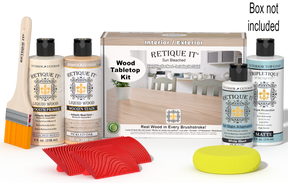 Retique It® Sun Bleached Wood Tabletop Kit with Bleached Wood primer, Pickled Oak stain, White Wash gel stain alternative, Tripletique® Matte Top Coat, brush, red graining tool, yellow sponge, and product box.