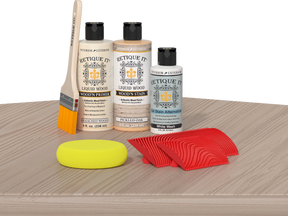 Retique It® Wood'n Kit Sun Bleached on table, featuring multiple wood finish components for furniture restoration.