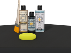 Retique It refinishing kit with Light Wood primer, Classic Black gel stain alternative, matte Tripletique topcoat, a brush and yellow sponge.
