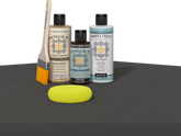 Retique It refinishing kit with Light Wood primer, Charcoal gel stain alternative, matte Tripletique topcoat, a brush and yellow sponge.