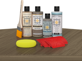Retique It® Weathered Wood Tabletop Wood'n Finish Kit with stain jars on a table for wood finishing and furniture restoration.