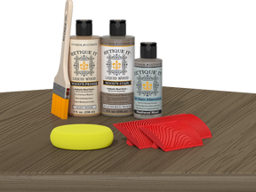 Retique It® Weathered Wood Fireplace Mantel Wood'n Finish Kit stain on a surface, showing the weathered wood texture and color.