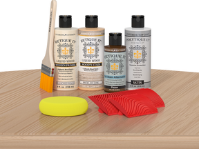 Retique It® Wood'n Finish Kit in White Oak, exterior top coat, with brushes and applicators on a table for wood finishing projects.