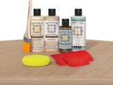 Retique It® White Oak Wood'n Kit with Bleached Wood primer, Pickled Oak stain, Pecan gel stain alternative, Matte Tripletique® Top Coat, brush, red graining tool, and yellow sponge.