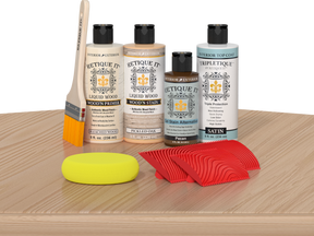 Retique It® White Oak Wood'n Kit with Bleached Wood Primer, Pickled Oak Wood'n Stain, Satin TripleTique Top Coat, Pecan Gel Stain Alternative, yellow sponge, red graining tool, and brush.