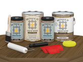 Retique It Wood'n Cabinet Kit with 48 barn wood-grained stained cabinet doors, shown on a table for easy installation.