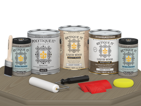 Retique It® Wood'n Finish Kit with four large driftwood-colored exterior top coat bottles on a table.