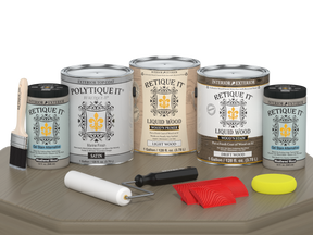 Retique It® Wood'n Finish Kit with four large driftwood exterior top coat bottles, satin finish, displayed on a table.