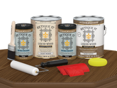 Retique It® Modern Walnut Wood Kit with gallon primer and stain, gel stains, brush, roller, yellow sponge, and red graining tools.
