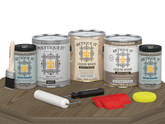 Retique It® Wood'n Finish Kit with four weathered wood exterior top coat samples in matte finish on a table.