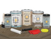 Retique It Wood'n Finish Kit with four weathered wood interior top coats, matte finish, shown on a wooden table surface.