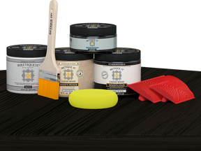 Retique It Wood'n Finish Front Door Kit in Classic Black with stain samples and finishing tools on a table.