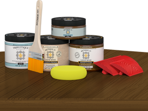 Retique It® Wood'n Finish Kit Double Size in Dark Pecan stain, featuring stain bottles and application tools on a table.